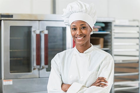 Chef smiling in kitchen