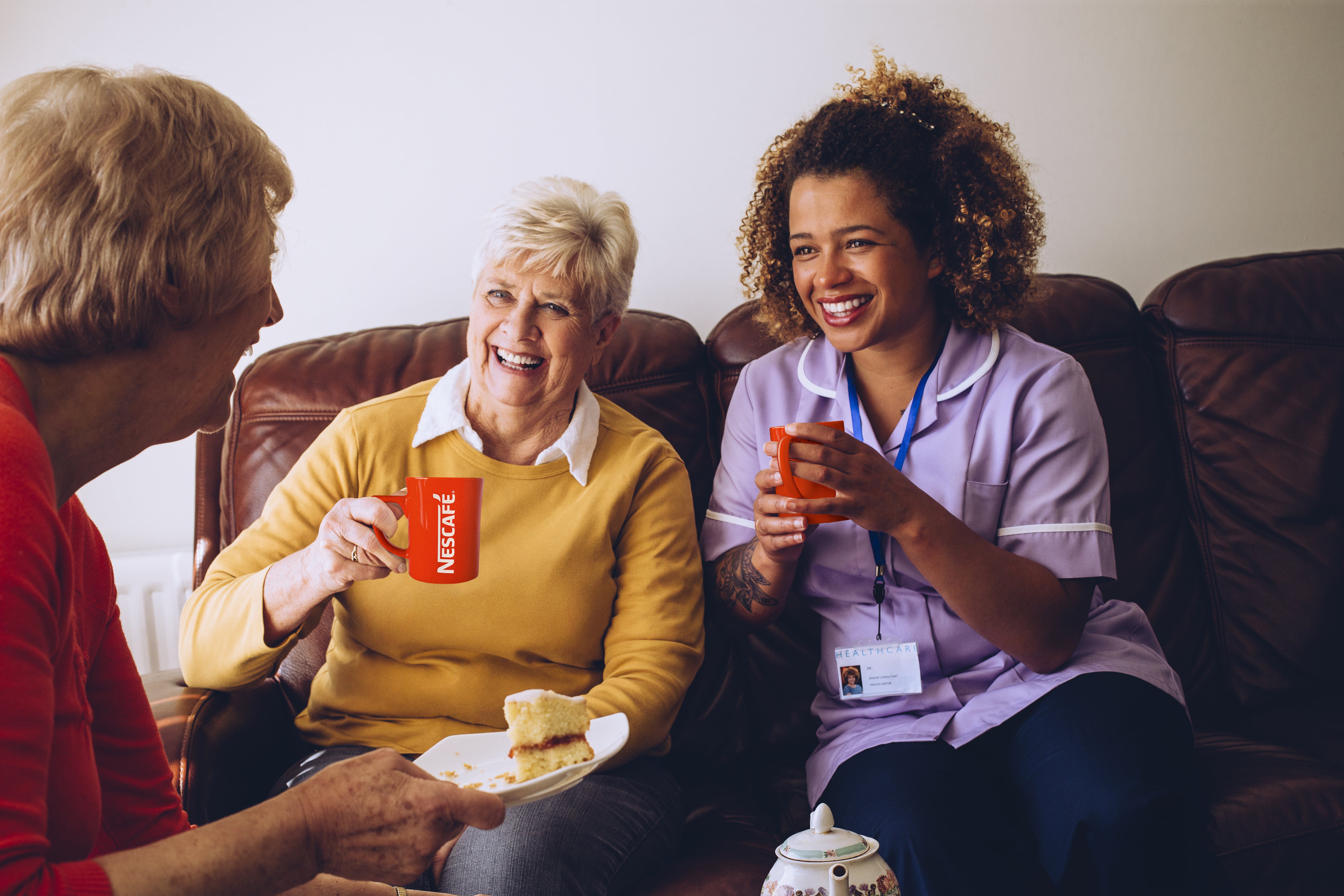 nurse drinking coffee with patients