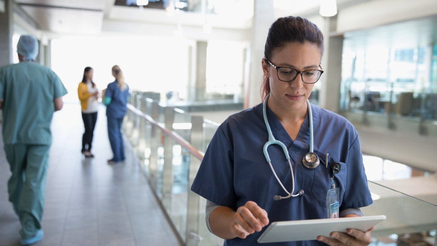 healthcare professional looking at notes