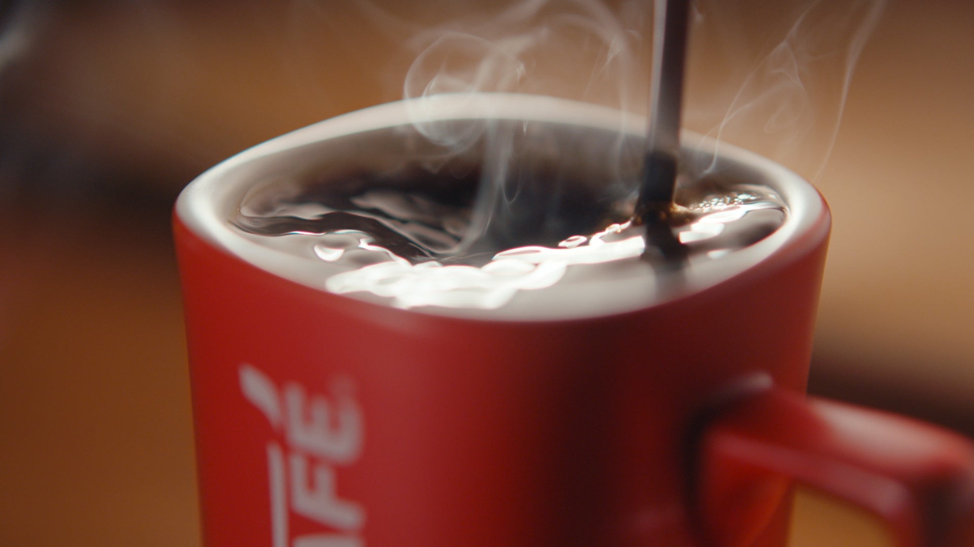 nescafe red mug with coffee in