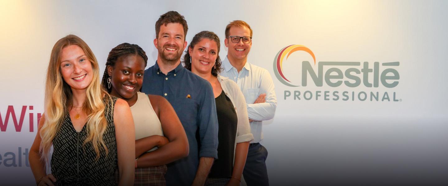 5 people standing together with the Nestle Professional logo