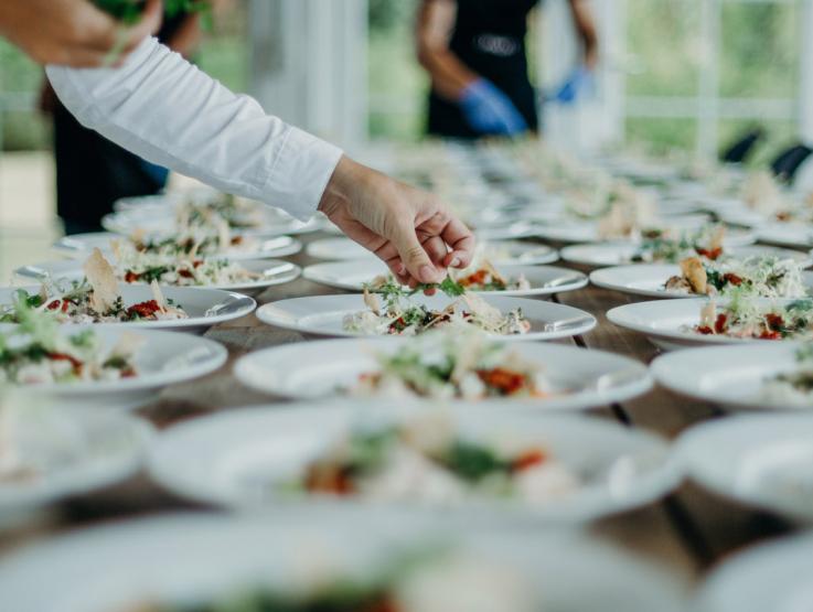 A chef plating food