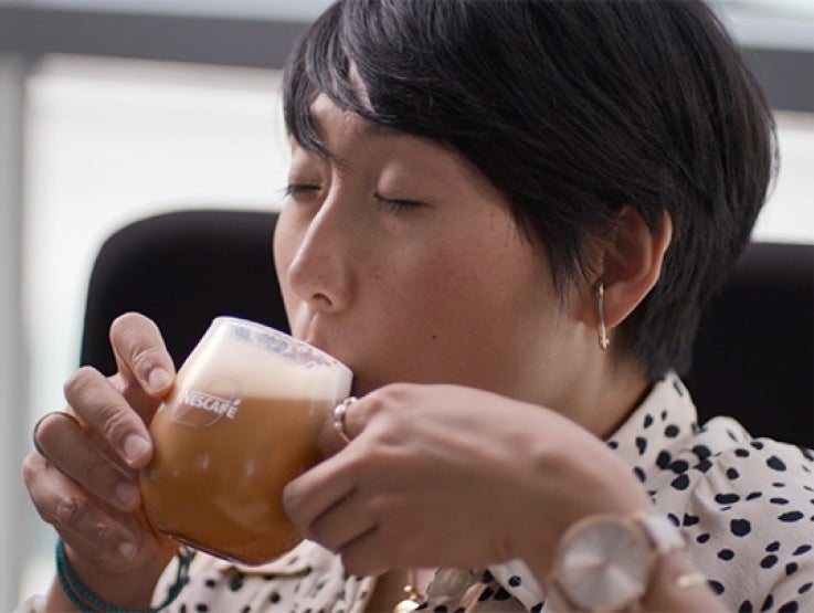 nescafe-frothy-lady-drinking-coffee