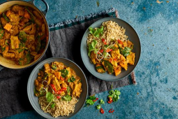 Two bowls of vegan african stew with rice