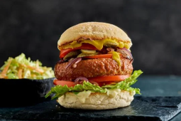 Vegan burger recipe with fries served on a black platter